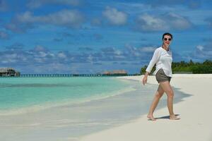happy young  couple at summer vacation have fun and relax at beach photo