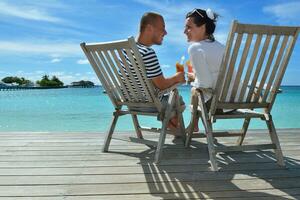 happy young couple relax and take fresh drink photo