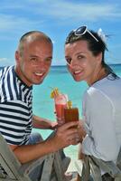 happy young couple relax and take fresh drink photo