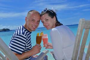 happy young couple relax and take fresh drink photo