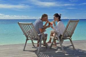 happy young couple relax and take fresh drink photo