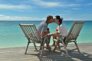 happy young couple relax and take fresh drink photo