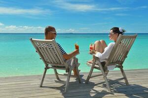 happy young couple relax and take fresh drink photo