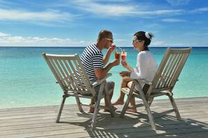 happy young couple relax and take fresh drink photo