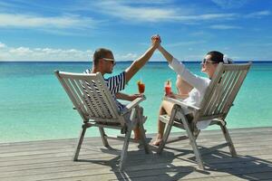 happy young couple relax and take fresh drink photo