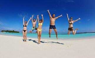 group of happy young people have fun on bach photo