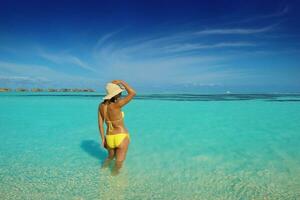 beautiful  woman resting on tropical  beach photo