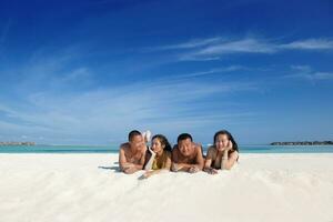 happy young  couple enjoying summer on beach photo