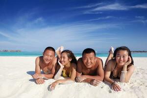 group of happy young people have fun on bach photo