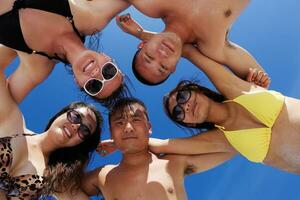 group of happy young people have fun on bach photo