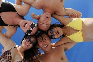 group of happy young people have fun on bach photo