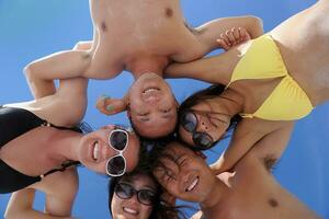 group of happy young people have fun on bach photo