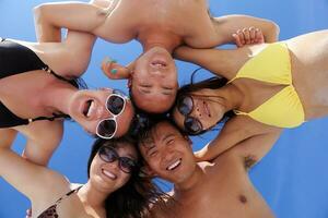 group of happy young people have fun on bach photo