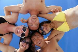 group of happy young people have fun on bach photo