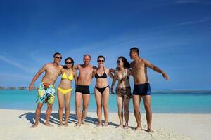 group of happy young people have fun on bach photo