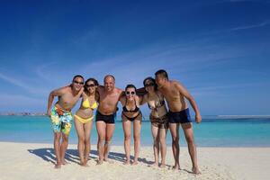 group of happy young people have fun on bach photo