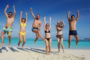 group of happy young people have fun on bach photo