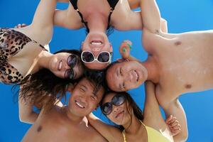 group of happy young people have fun on bach photo