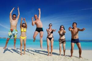 group of happy young people have fun on bach photo