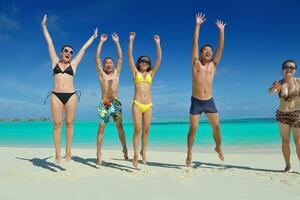 group of happy young people have fun on bach photo