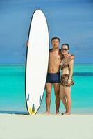 happy young  couple enjoying summer on beach photo