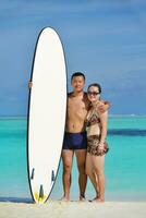 happy young  couple enjoying summer on beach photo