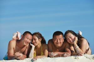 group of happy young people have fun on bach photo