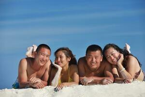 group of happy young people have fun on bach photo