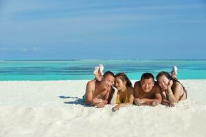 group of happy young people have fun on bach photo