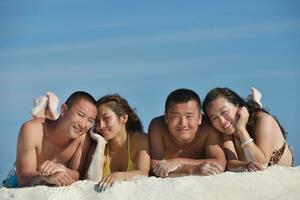 group of happy young people have fun on bach photo