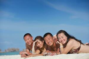 group of happy young people have fun on bach photo