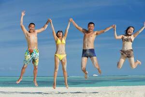 group of happy young people have fun on bach photo