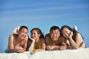 group of happy young people have fun on bach photo