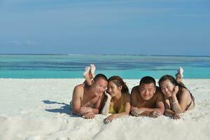 group of happy young people have fun on bach photo