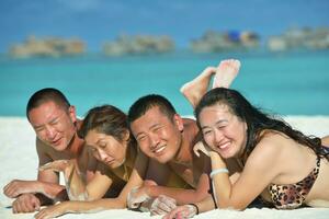 group of happy young people have fun on bach photo