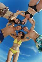 group of happy young people have fun on bach photo