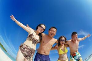 group of happy young people have fun on bach photo