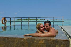 happy young  couple at summer vacation have fun and relax at beach photo