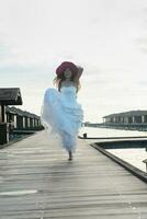 asian bride on beach photo