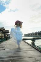 asian bride on beach photo