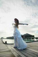 asian bride on beach photo