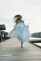 asian bride on beach photo