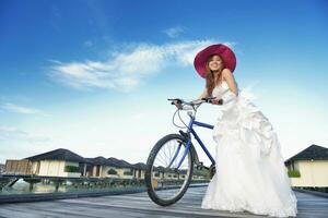 asian bride on beach photo