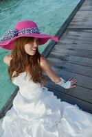 asian bride on beach photo