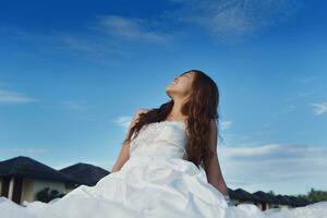 asian bride on beach photo