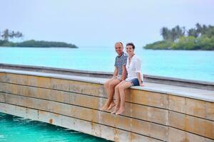 happy young couple have fun on beach photo