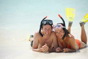 happy young couple have fun on beach photo