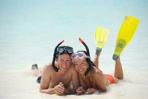 happy young couple have fun on beach photo