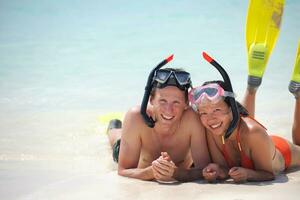 happy young couple have fun on beach photo