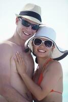 happy young couple have fun on beach photo